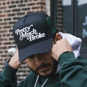 Black APTHCRY Trucker Cap with Yellow Logo